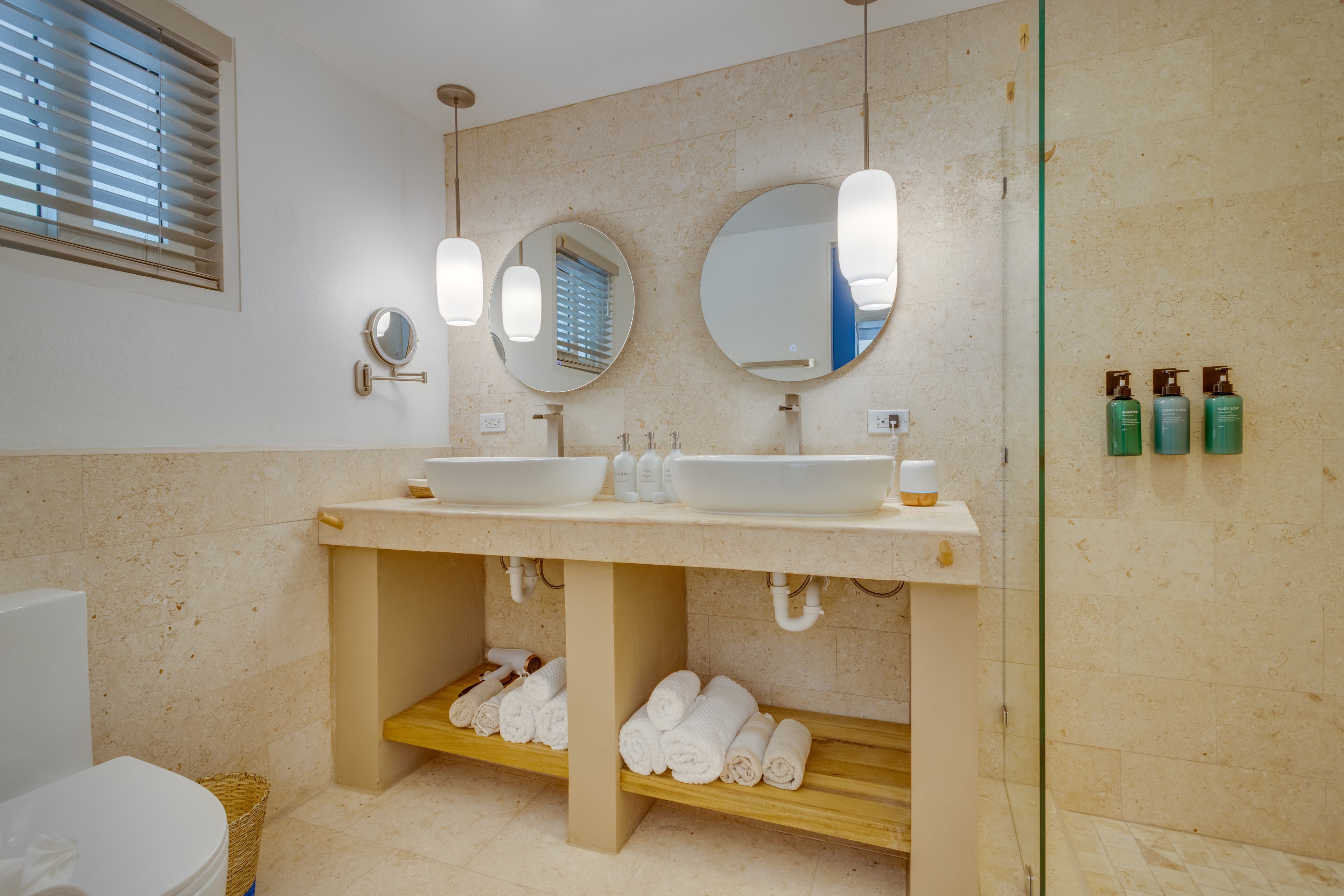 Spa-style bathroom with beach, bath and hair towels plus aromatherapy diffuser