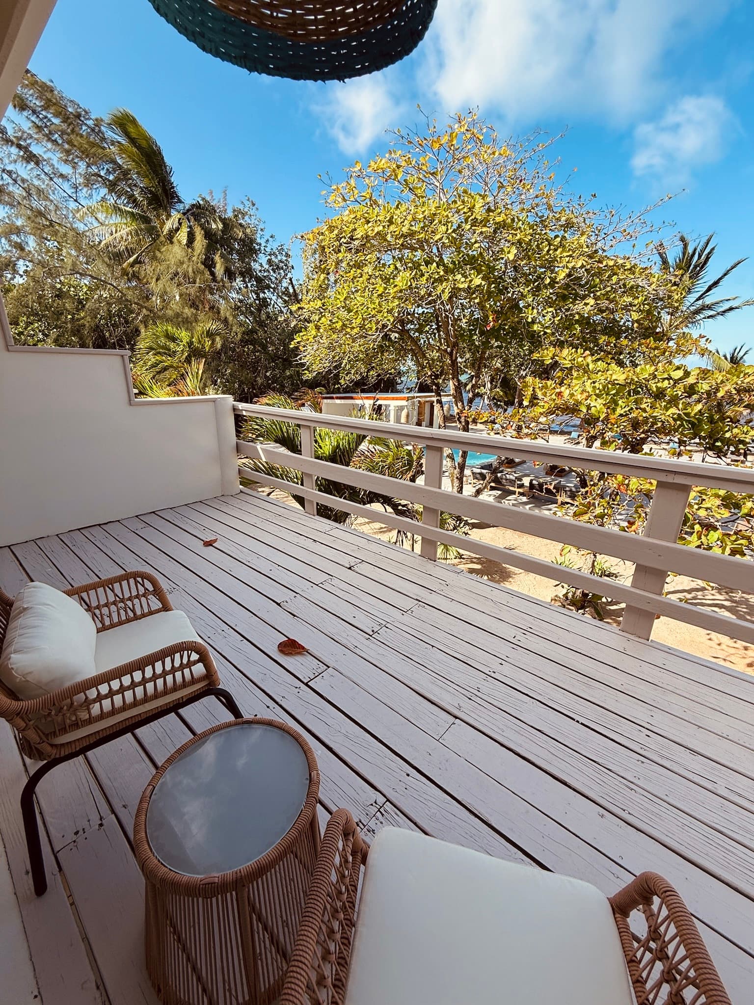 Relax with a sundowner or a sunrise coffee and watch the trees and beach below