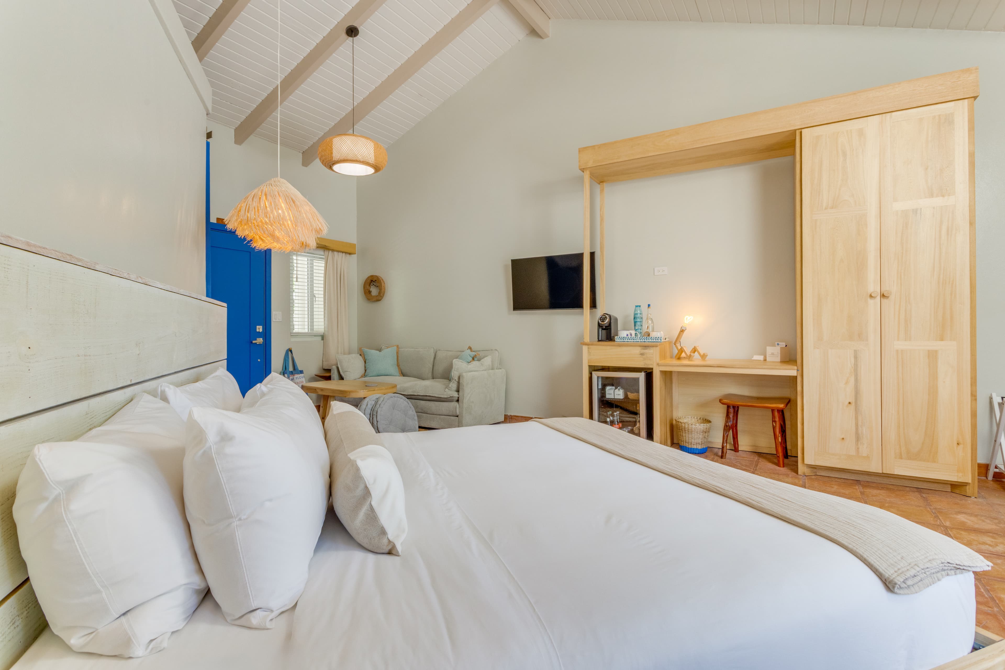 Closet, built-in writing desk, minibar, flat screen TV with streaming and couch