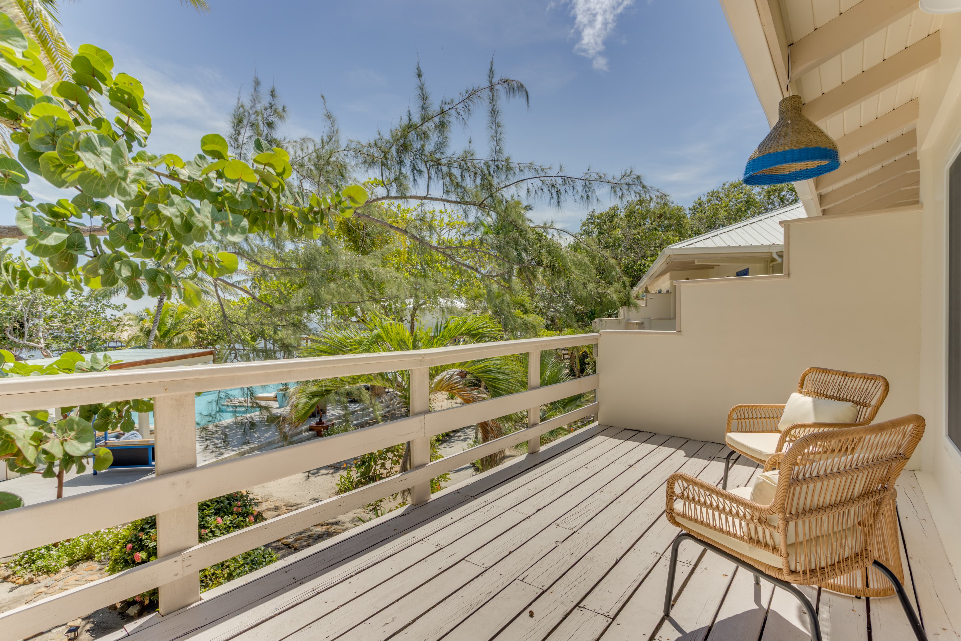 Your tropical bird's eye view of the lush gardens, pool and beach below