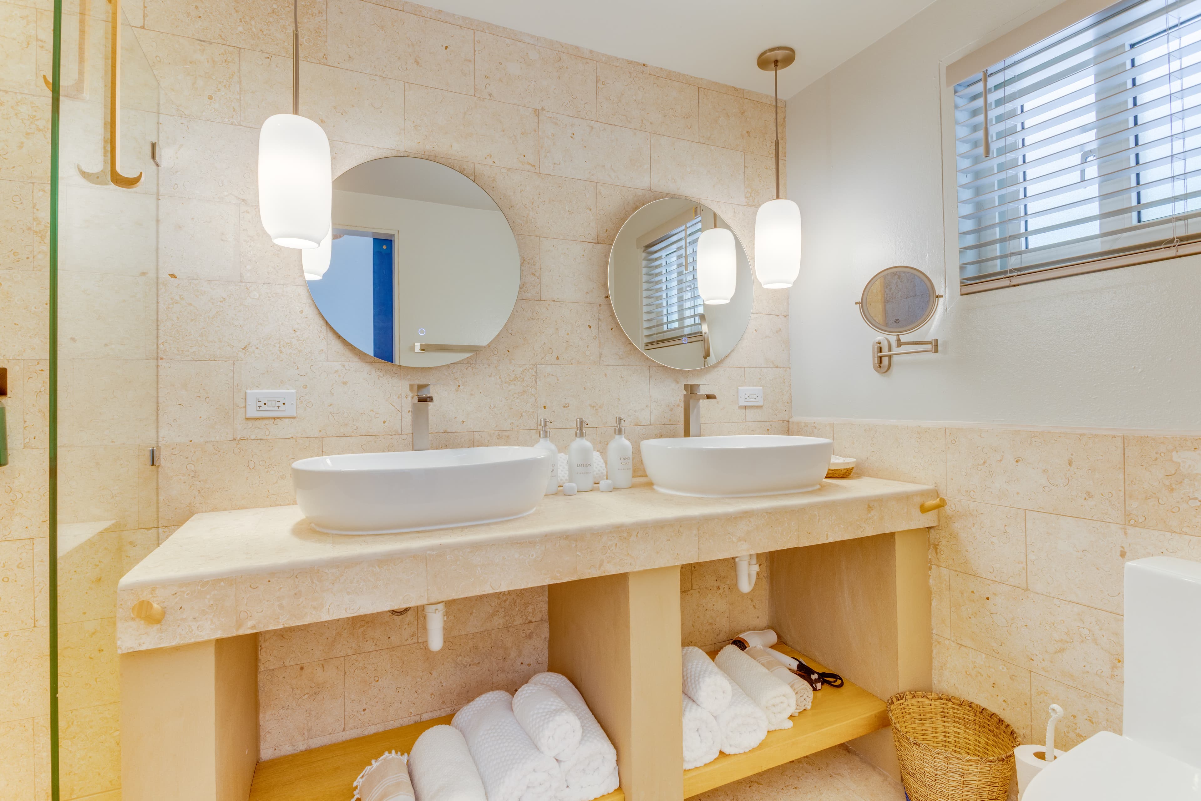 Double vanity with bath, hair and beach towels plus anti-fog backlit mirrors