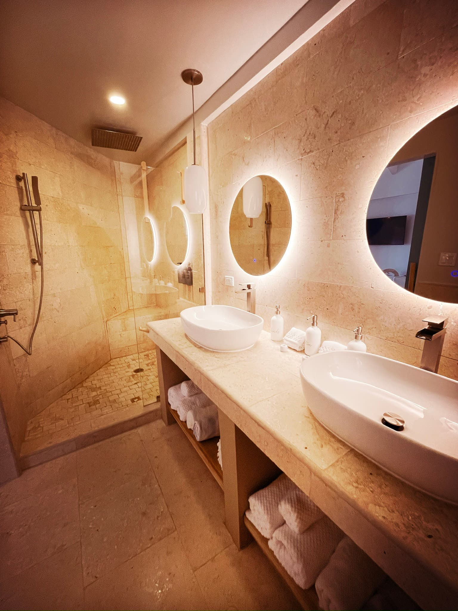 Rain shower with eco conscious toiletries and spa lighting.