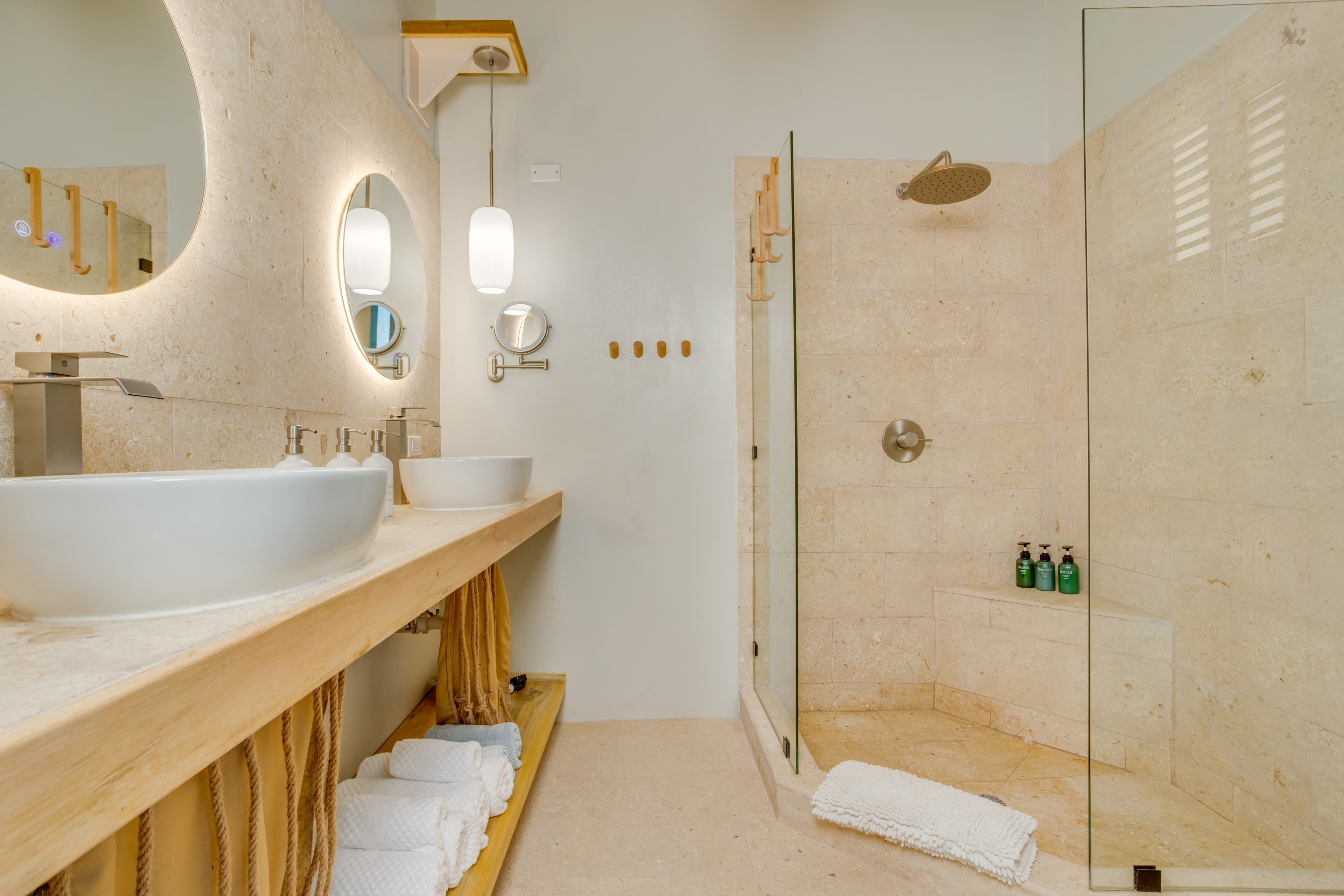 Double vanity with bath, hair and beach towels plus anti-fog backlit mirrors