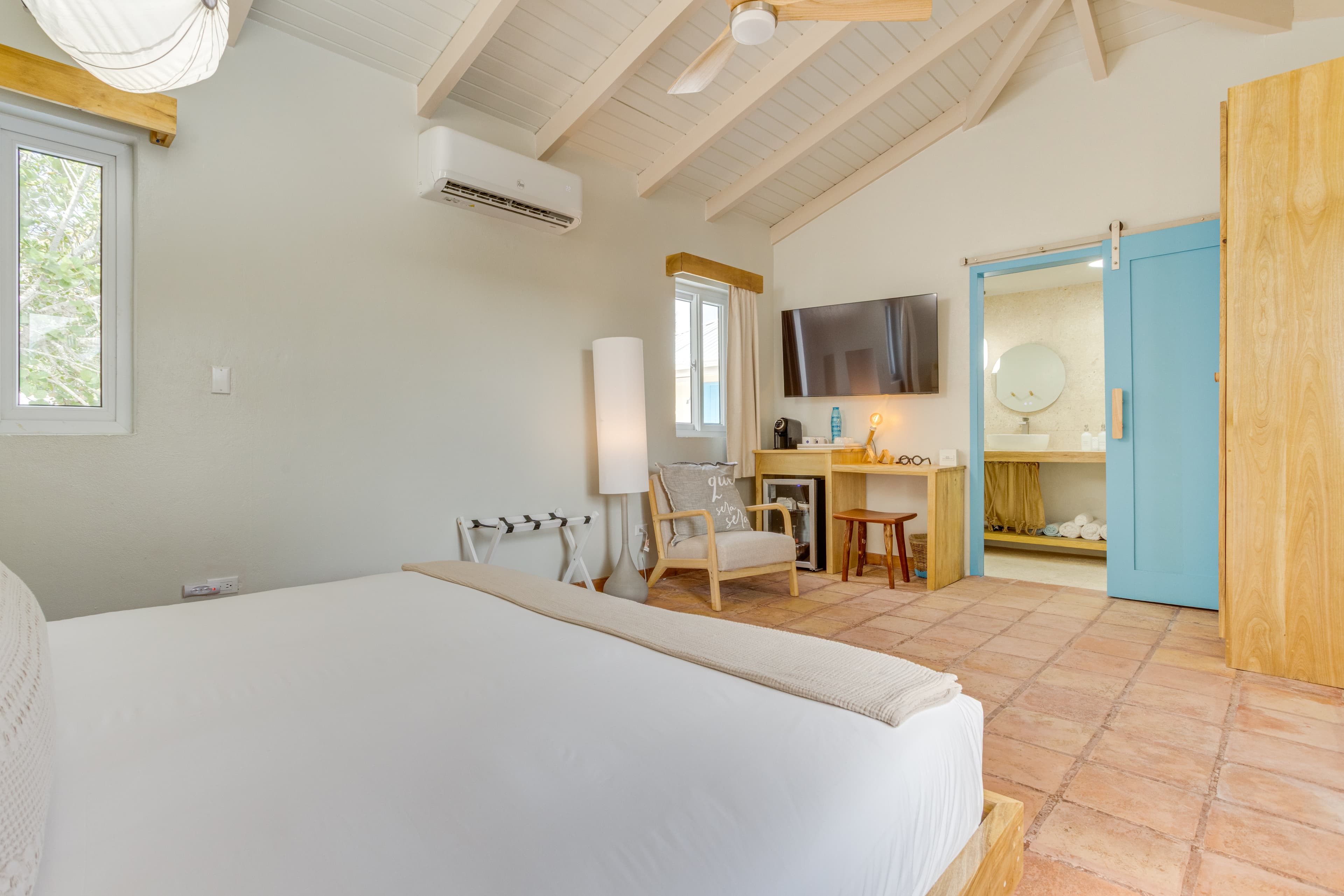 Spacious suite with remote controlled AC and fan and charging stations