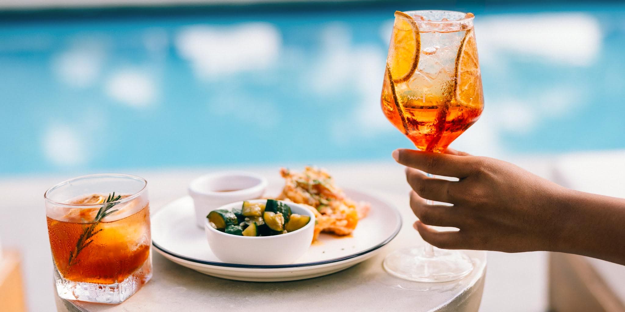 Laid-back poolside cocktail and snack experience at Blue Reef Beach Resort, a boutique beachfront retreat on the Placencia Peninsula, Southern Belize