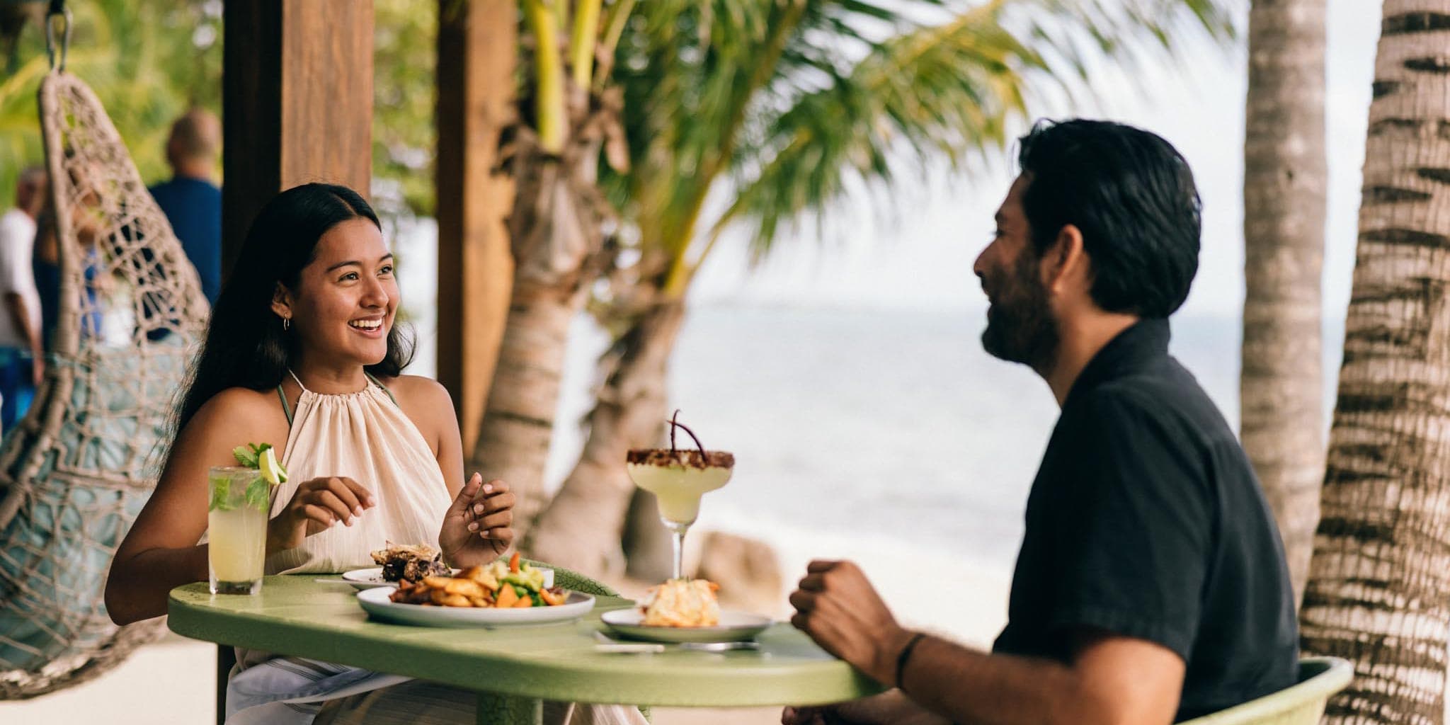 Idyllic romantic alfresco lunch experience for two at Bamboo Beach Bistro, a beachfront dining destination at Blue Reef Beach Resort, Placencia Peninsula, Southern Belize