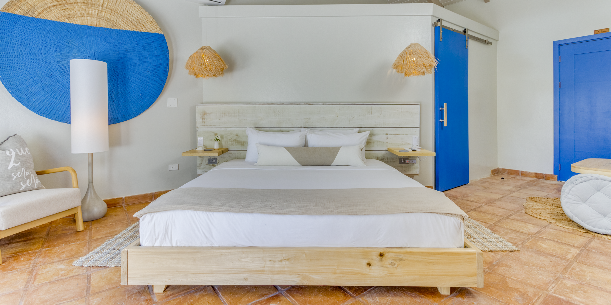 The king bed inside one of the poolfront suites at Blue Reef Beach Resort